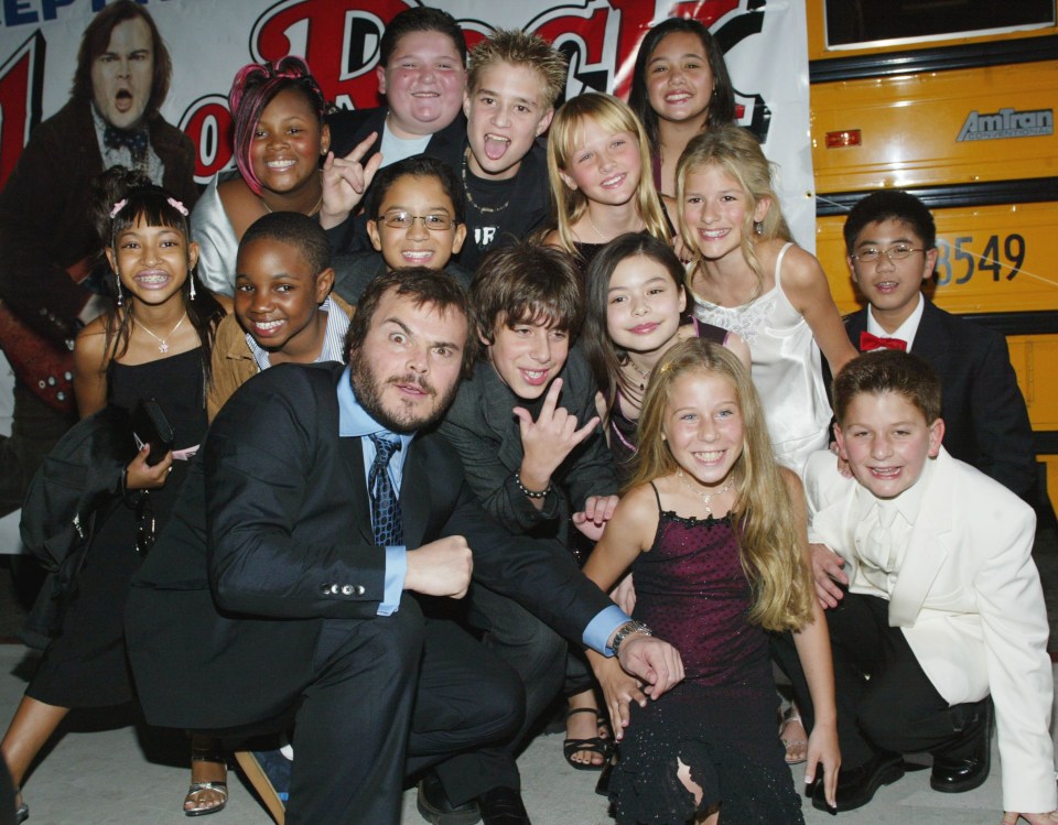 Jack Black can be seen with the cast of School of Rock above