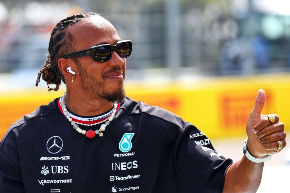 Lewis Hamilton giving a thumbs up at the drivers' parade.