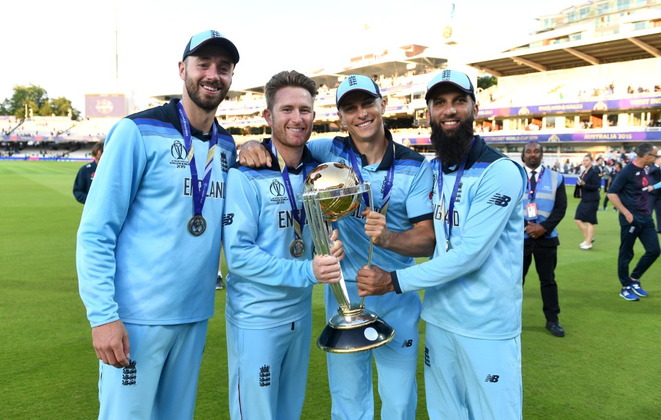 England cricket team celebrating with the Cricket World Cup trophy.