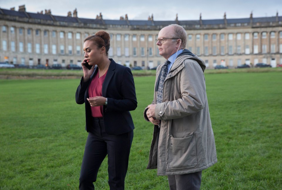 DCI Lauren McDonald and DS Dodds on a grassy field.