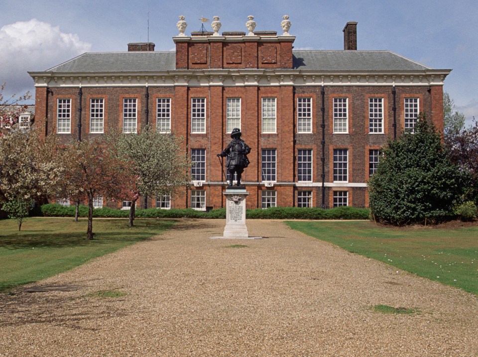 Kensington Palace in London, circa 1990s, with a statue in the foreground.