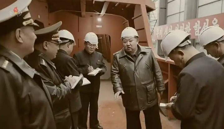 Kim Jong Un oversees the construction of a North Korean warship.