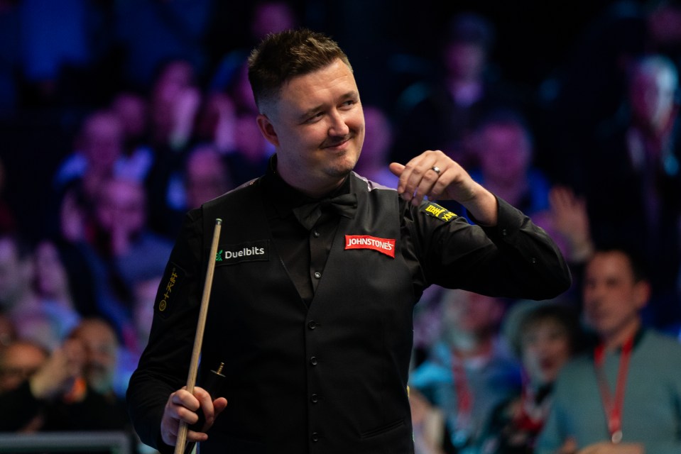 Kyren Wilson celebrating a snooker victory.