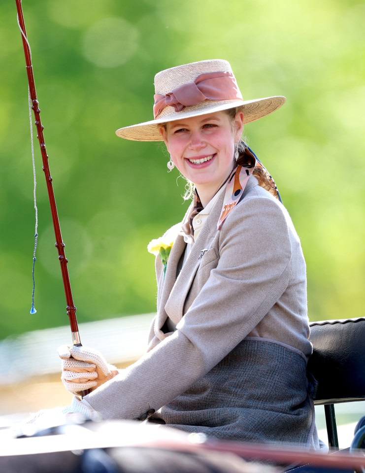 Lady Louise Windsor smiles while participating in a carriage driving event.