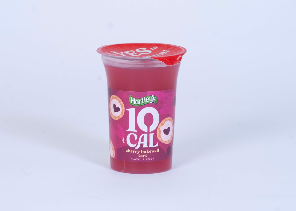 Hartley's 10 calorie cherry bakewell tart flavour jelly in a plastic cup.