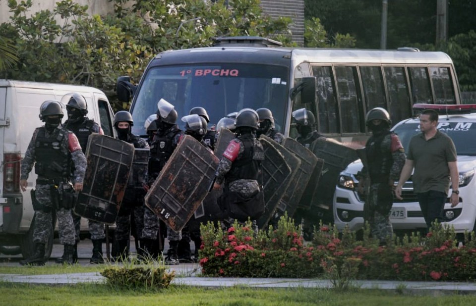 Riot police preparing to raid a Brazilian prison where at least 40 inmates were killed.