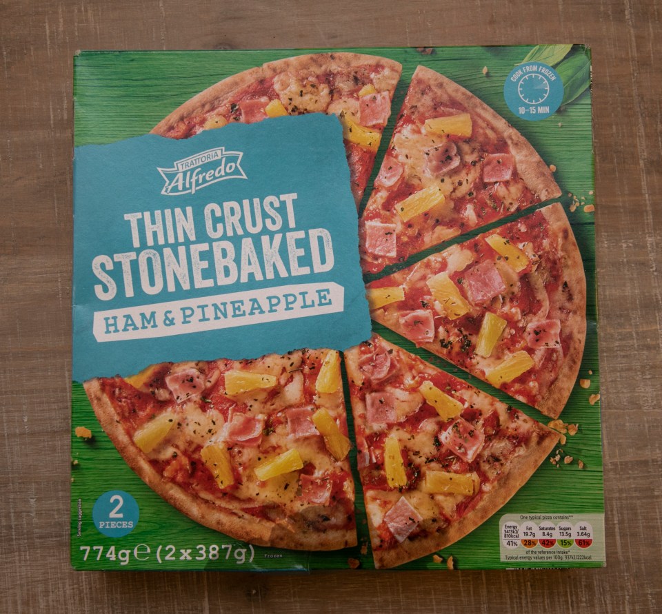 Box of Alfredo thin crust stonebaked ham and pineapple pizza.