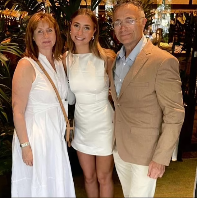 Lily Phillips with her mother Emma and father Lindsay.