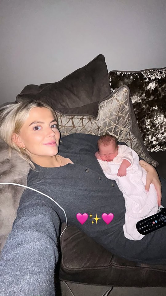 Lucy Fallon holding her newborn baby girl.