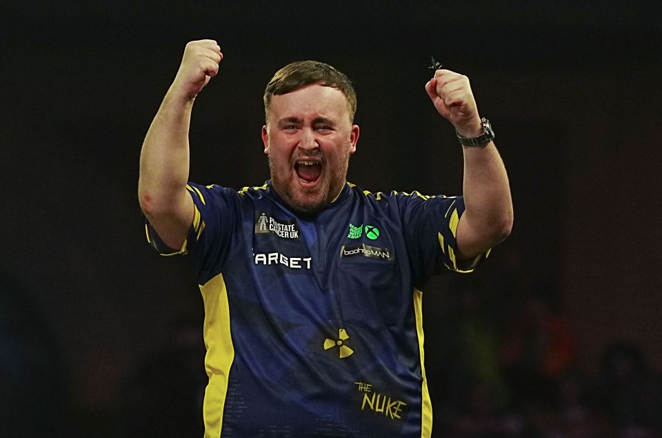 Luke Littler celebrates winning the PDC World Darts Championship.