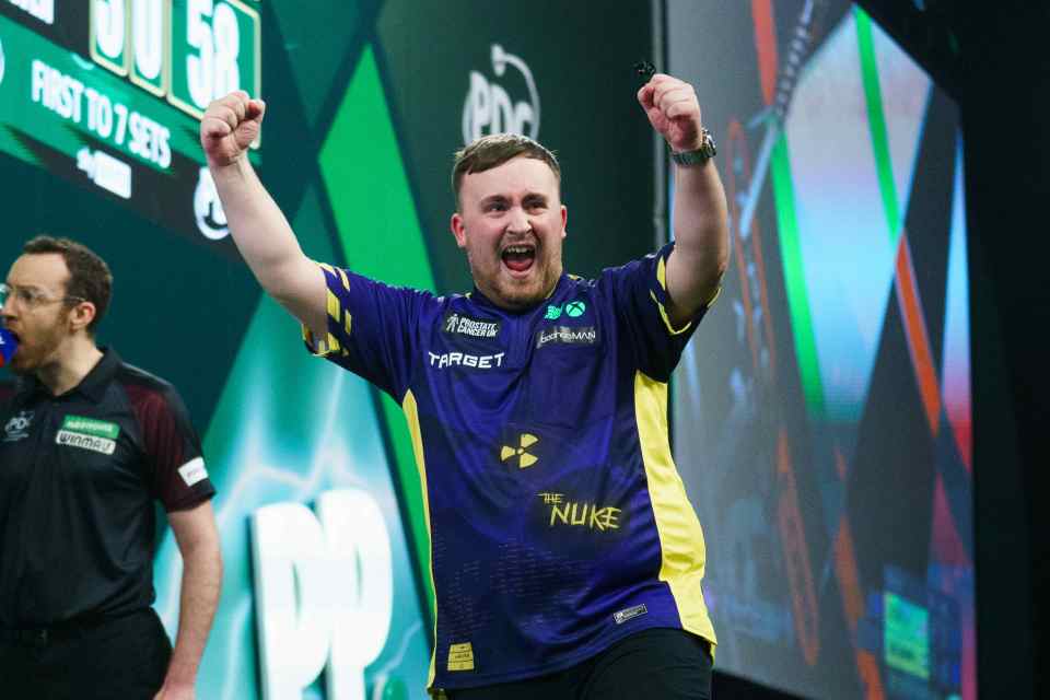 Luke Littler celebrating a darts championship win.