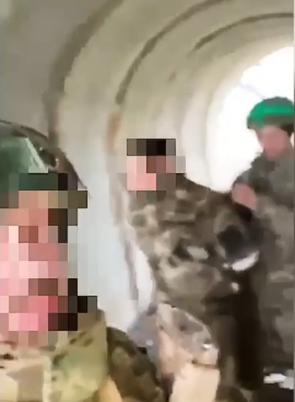 Video still image of Ukrainian soldiers in a tunnel.