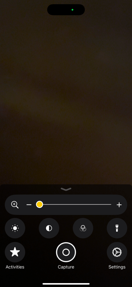 Magnifier controls with zoom, brightness, flashlight, and settings options.