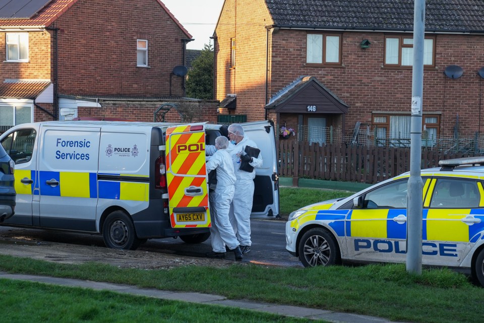 Forensic officers at a crime scene.