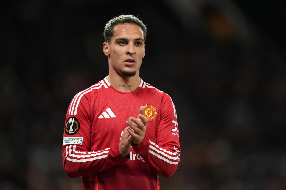 Manchester United's Antony applauds fans.