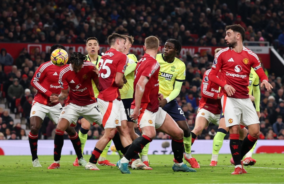 Manuel Ugarte deflects a shot, scoring an own goal for Southampton against Manchester United.