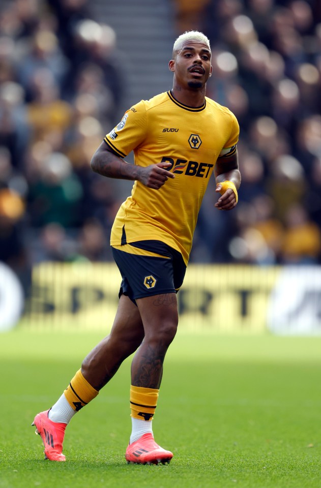 Mario Lemina of Wolverhampton Wanderers running on a soccer field.