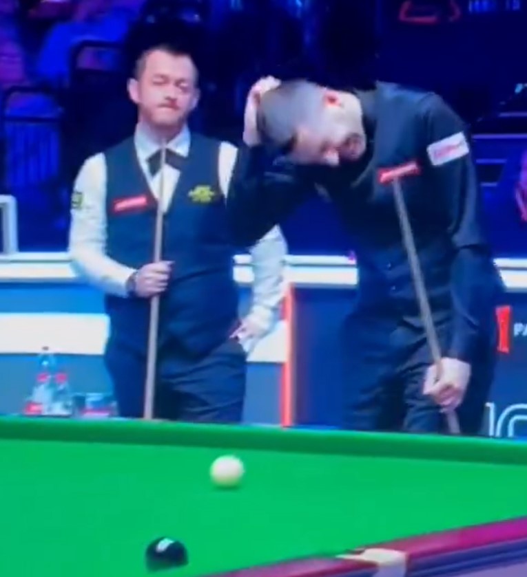 Snooker players Mark Allen and Mark Selby during a match.