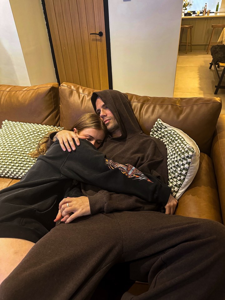 Man in hospital gown lying in a hospital bed.