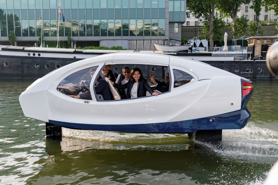 Paris Mayor Anne Hidalgo in an electric flying taxi on the Seine River.