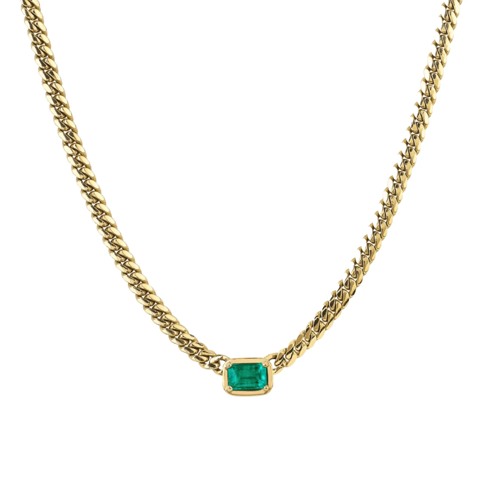 Gold necklace with emerald pendant.