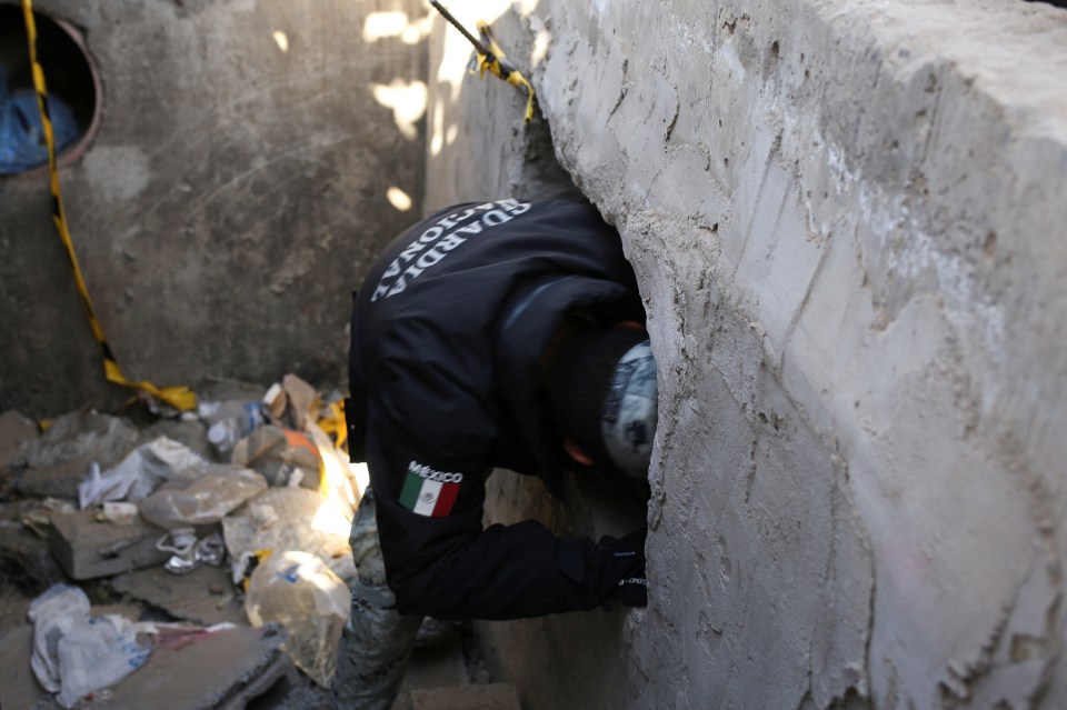 A member of the Mexican National Guard entering a closed illegal tunnel on the US-Mexico border.