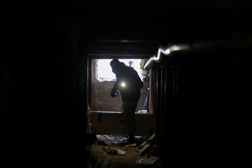 National Guard member inspecting a closed illegal tunnel at the US-Mexico border.