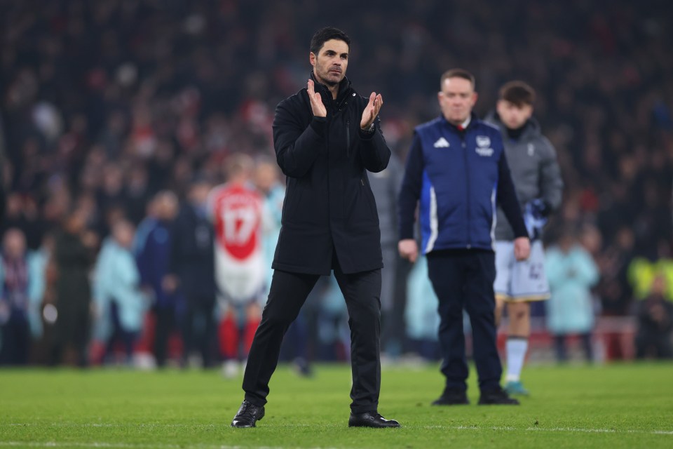 Mikel Arteta, Arsenal's manager, applauding on the pitch.