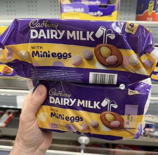 Two packages of Cadbury Dairy Milk chocolate with mini eggs.