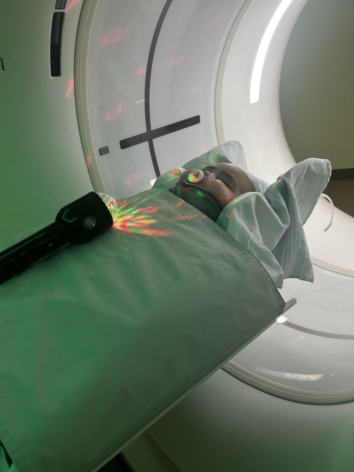 Baby in a hospital undergoing a scan.