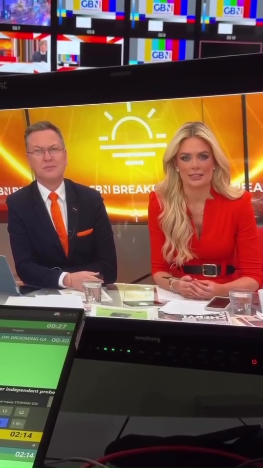 Eamonn Holmes and a female co-host at a news desk.