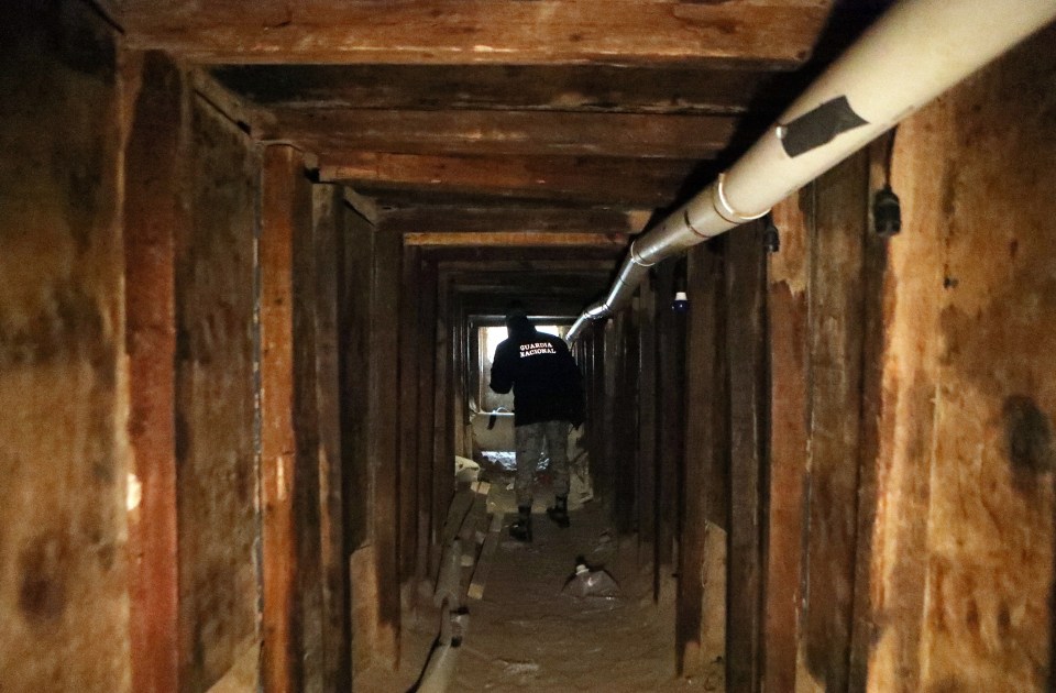 National Guard agent inspecting an illegal tunnel at the US-Mexico border.