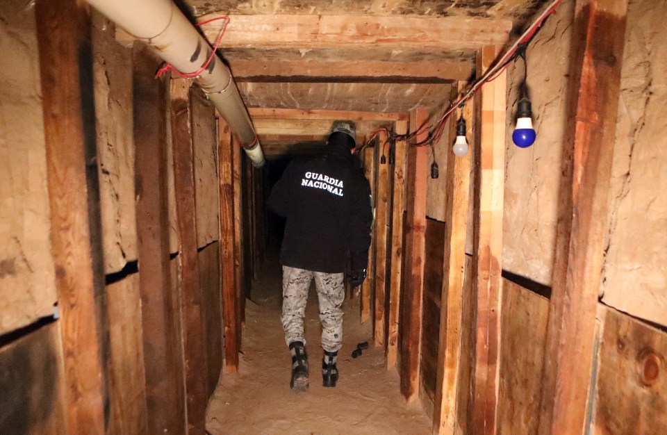 National Guard agent inspecting an illegal tunnel at the US-Mexico border.