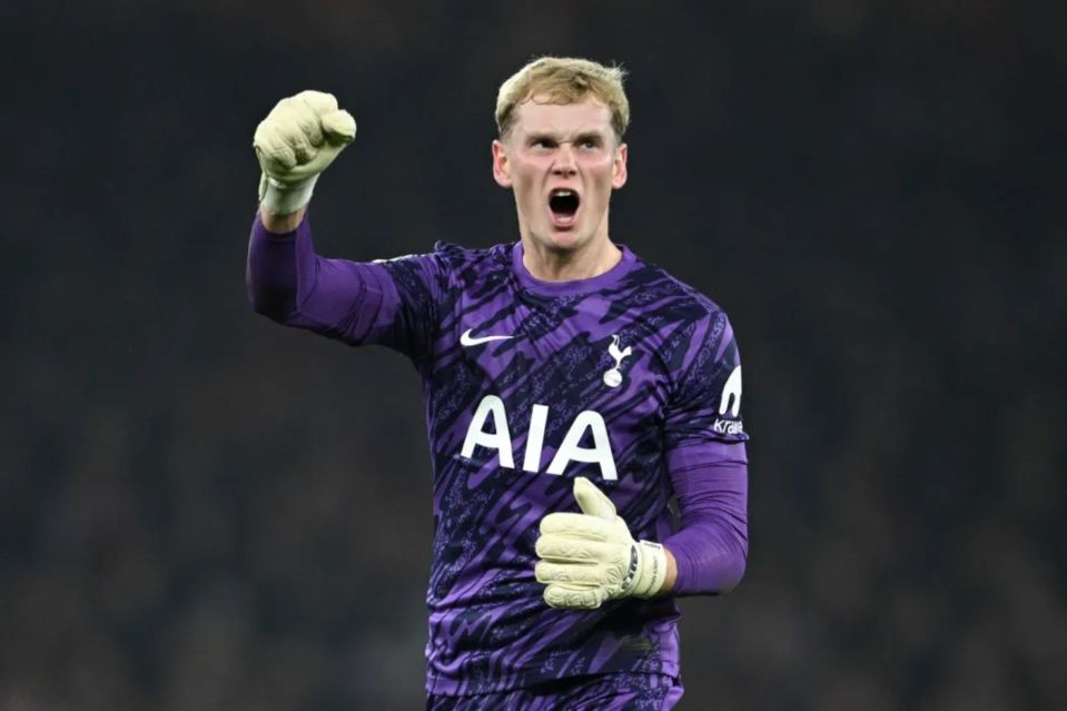 Soccer goalie celebrating a save.