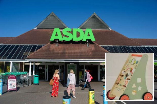 ASDA supermarket exterior with a wooden toy in the foreground.