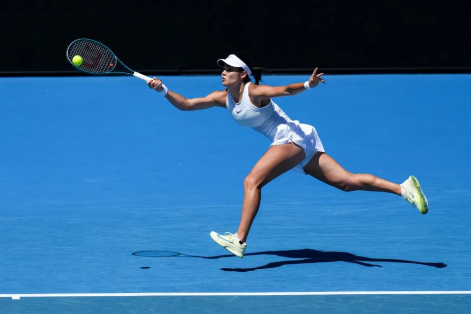 Tennis player hitting a forehand.