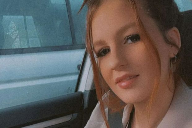 Close-up of a young woman in a car.