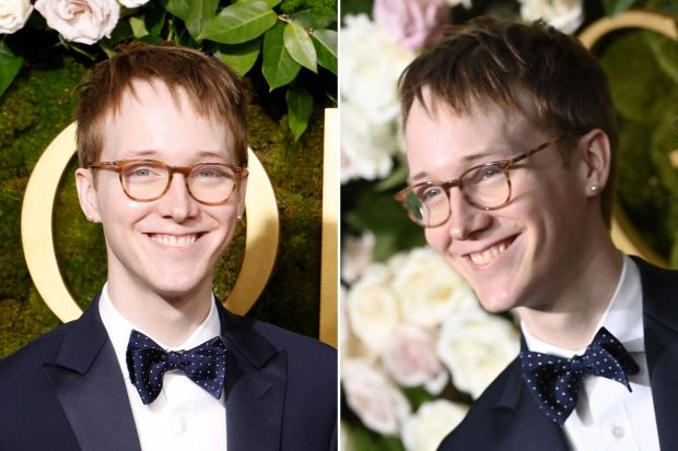 Headshot of a young man in a tuxedo and bow tie.