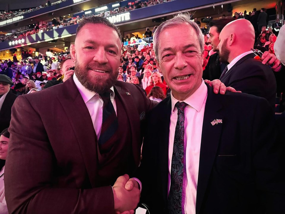 Conor McGregor and Nigel Farage shaking hands.