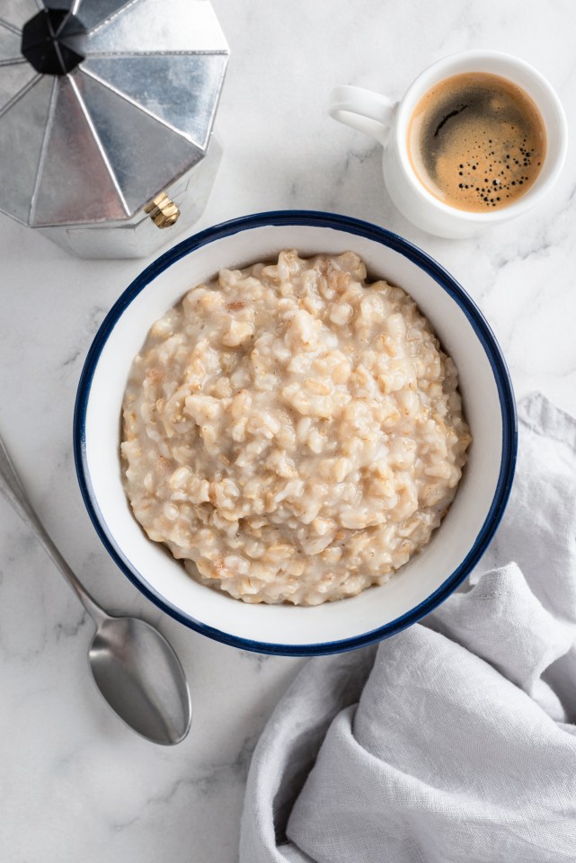 Oatmeal porridge and a cup of coffee.