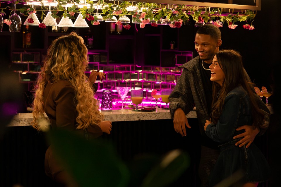 Matilda Draper and Roman Hackett at a bar.