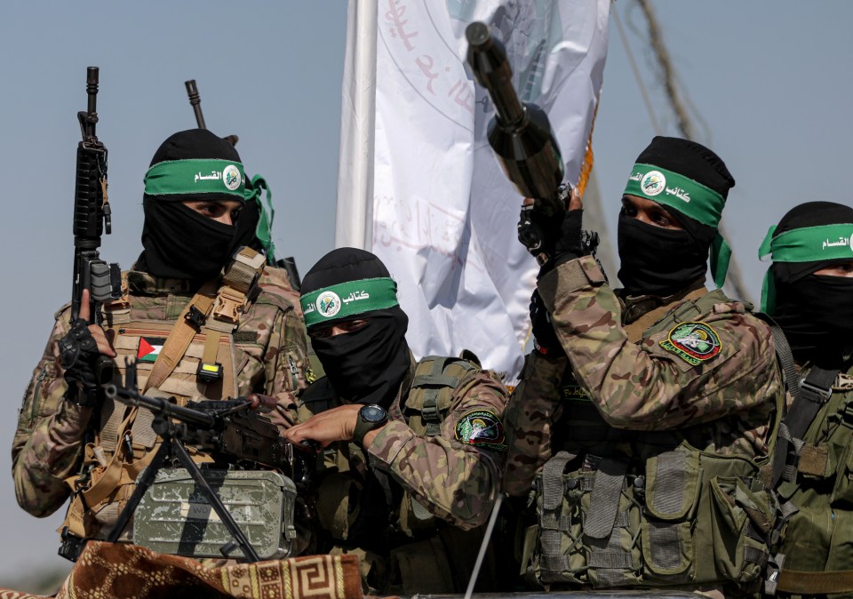 Palestinian Hamas fighters in military parade.