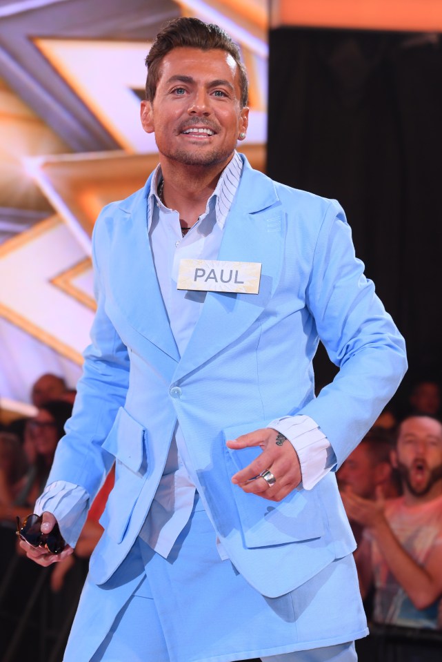 Paul Danan, a Celebrity Big Brother contestant, wearing a light blue suit.