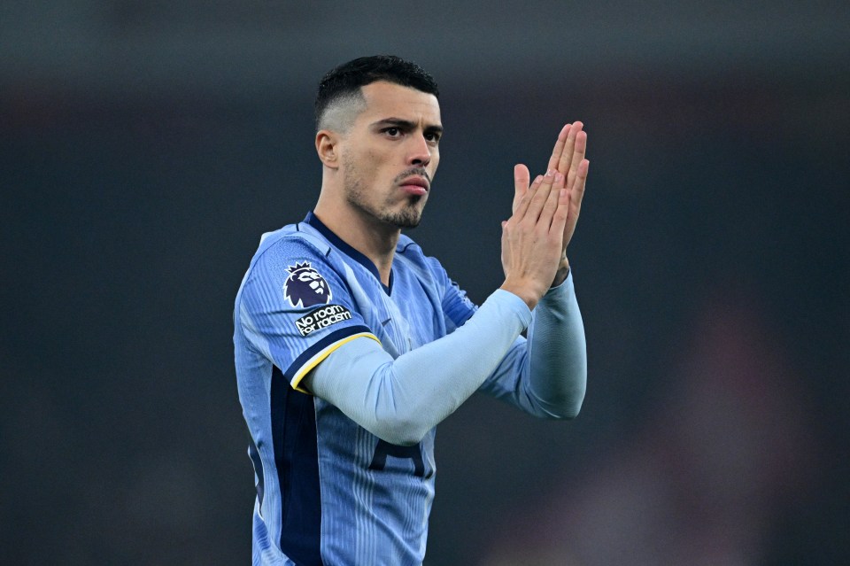 Pedro Porro of Tottenham Hotspur applauding.