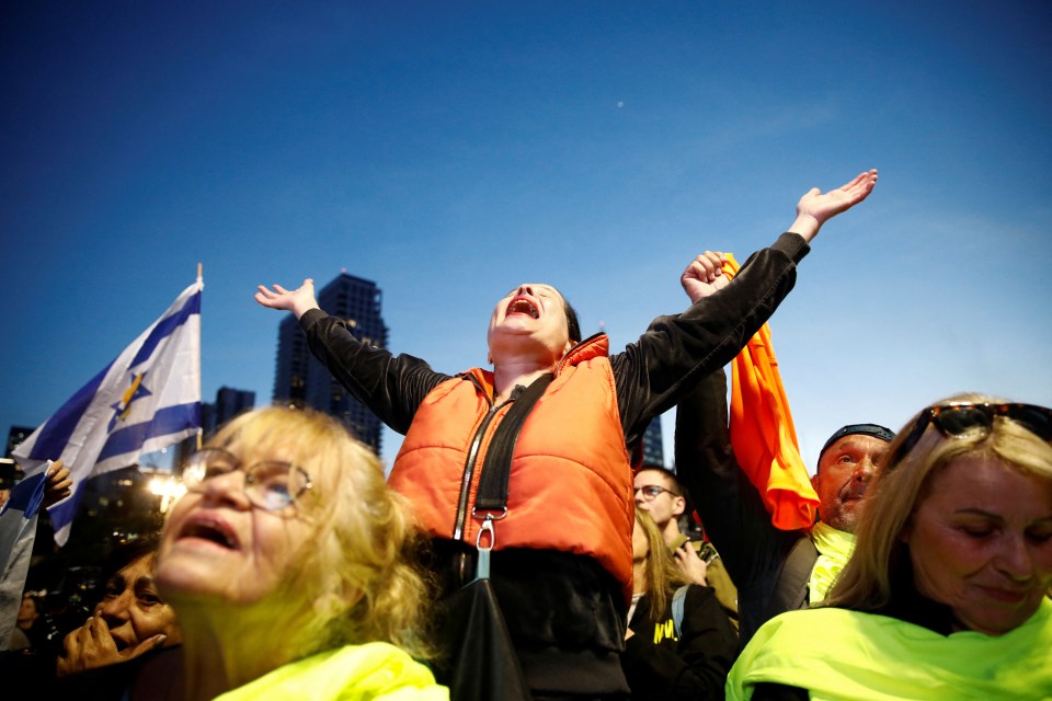 People react joyfully to news of released hostages in Tel Aviv.