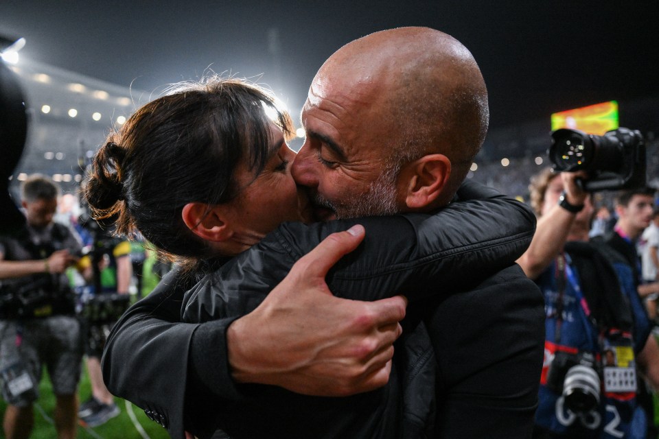 Pep Guardiola kissing his wife after a Manchester City victory.