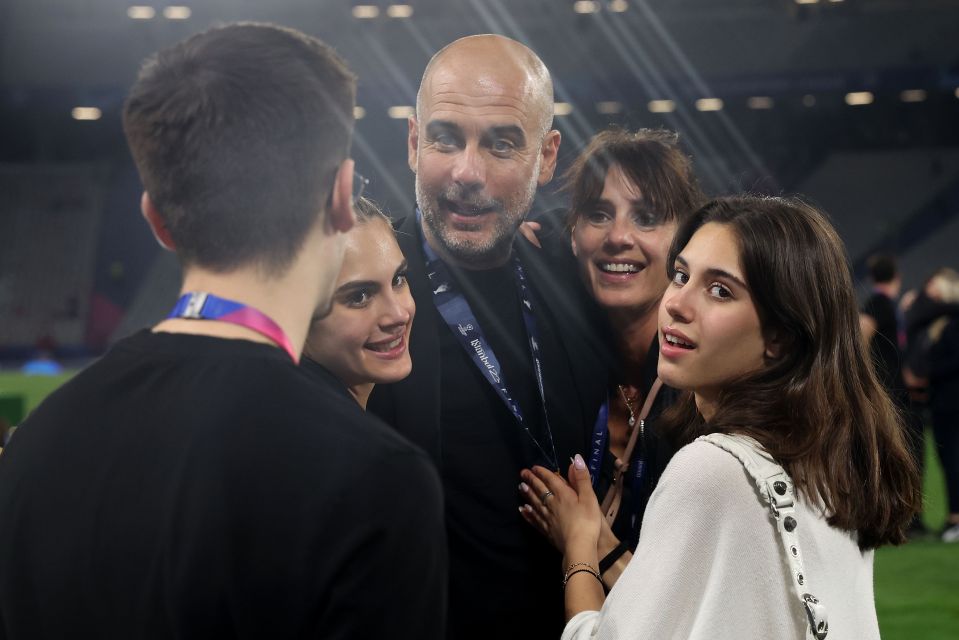 Pep Guardiola celebrating with his family after a Manchester City victory.