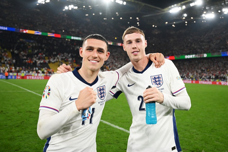 Phil Foden and Cole Palmer of England celebrating after a victory.