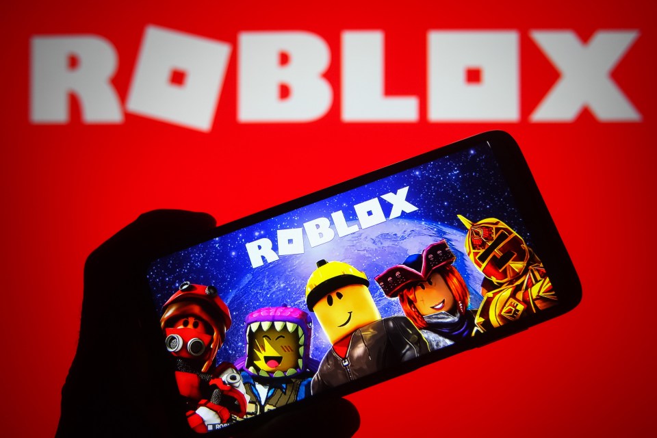 Roblox logo displayed on a smartphone and a PC screen.