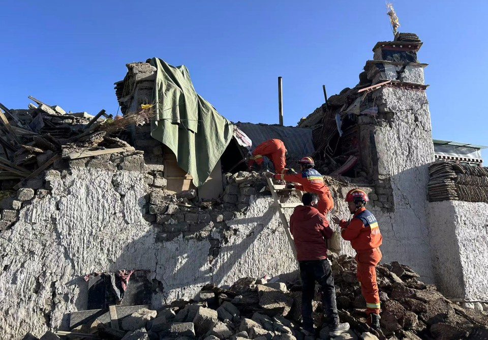 Rescue workers search for survivors among the rubble